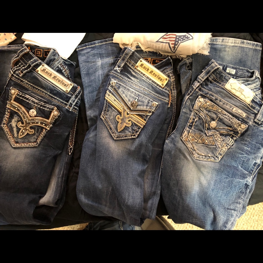 buckle jeans. from left to right size 26, 27, 28.